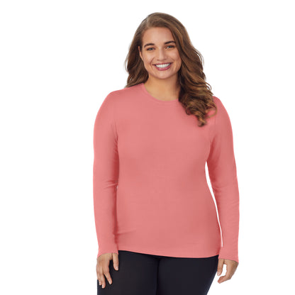 Bright Coral; Model is wearing size 1X. She is 5'7", Bust 42.5", Waist 34.5", Hips 46". @A lady wearing a bright coral long sleeve stretch crew plus.