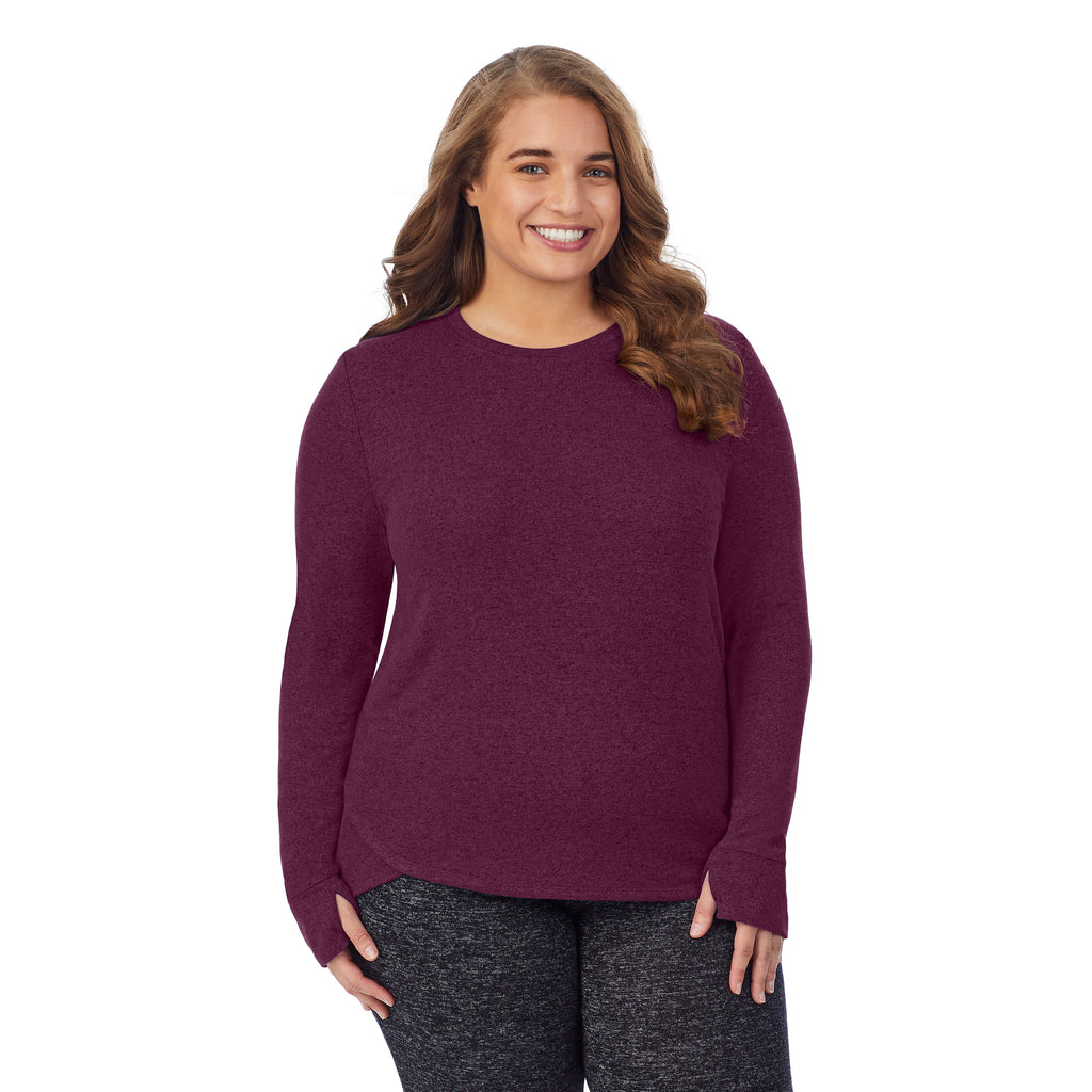 A lady wearing a marled grape long sleeve crew plus.