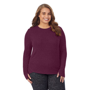 A lady wearing a marled grape long sleeve crew plus.