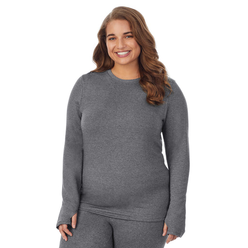 A lady wearing charcoal heather long sleeve crew plus.