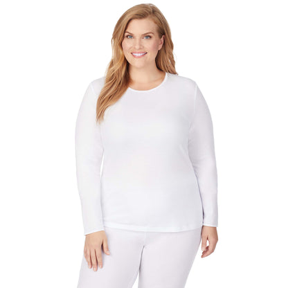 A lady wearing a white long sleeve crew plus.