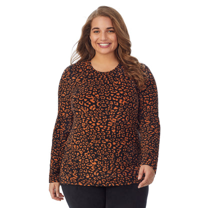 Amber Animal; Model is wearing size 1X. She is 5'7", Bust 42.5", Waist 34.5", Hips 46".@Upper body of a lady wearing amber animal long sleeve crew