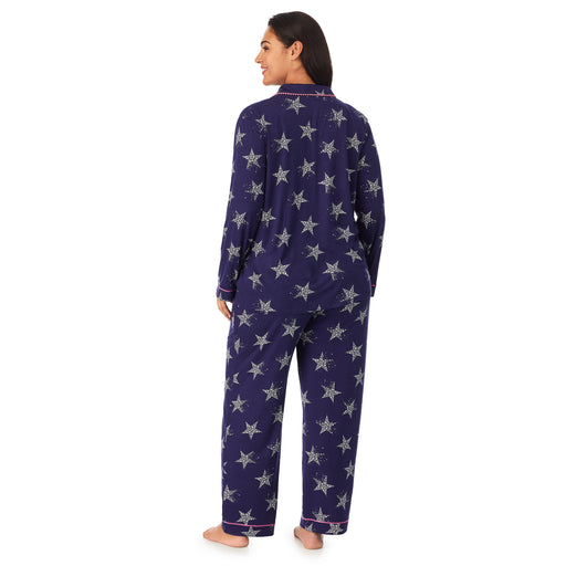 Navy Star; Model is wearing size 1X. She is 5’11”, Bust 38”, Waist 34”, Hips 46”. @A lady wearing a navy long sleeve notch pajama set plus with star pattern.