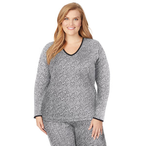A lady wearing a cheetah long sleeve lace edge V-neck plus.