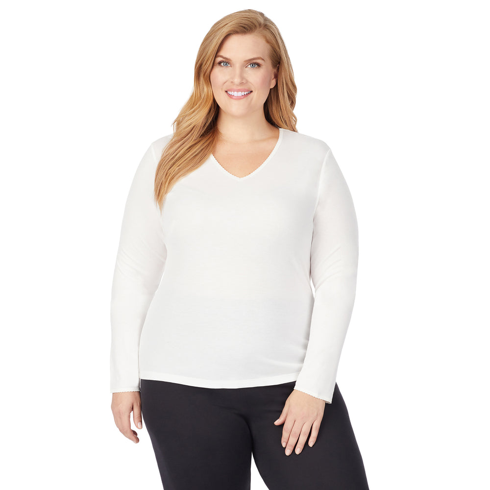 A lady wearing Softwear Lace Edge Long Sleeve V-Neck PLUS in Ivory