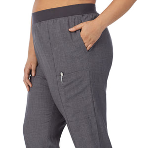  A lady wearing charcoal heather scrub slim cargo pant plus.