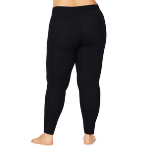 A lady wearing a black stretch legging plus.