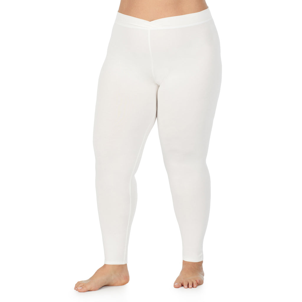 A lady wearing a ivory stretch legging plus.