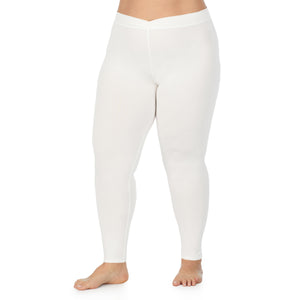 A lady wearing a ivory stretch legging plus.