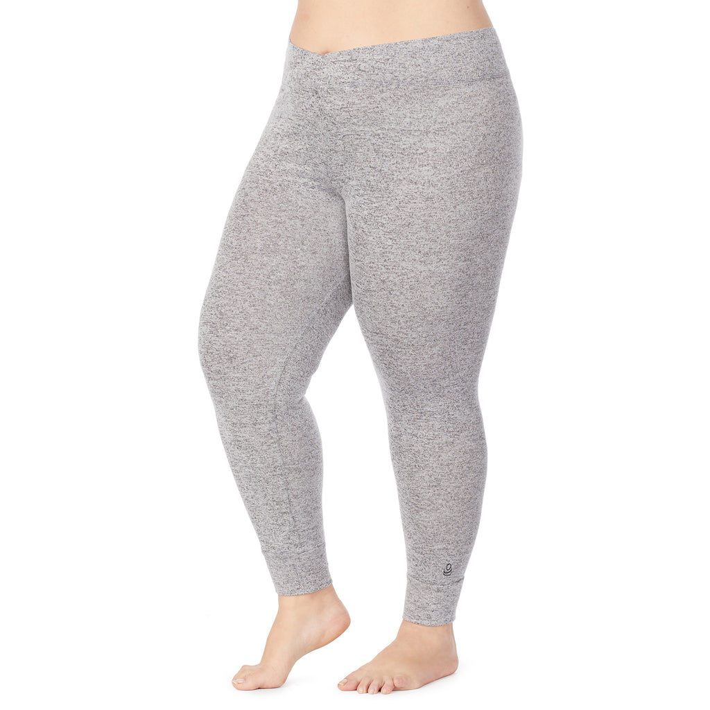 A lady wearing a marled grey legging plus.