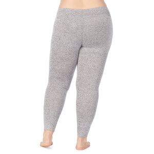 A lady wearing a marled grey legging plus.