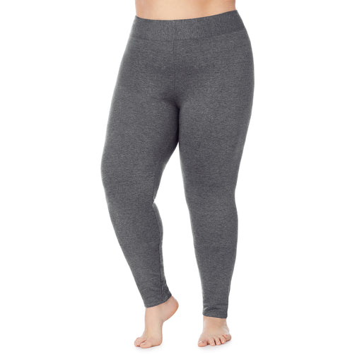 A lady wearing a charcoal heather legging plus.