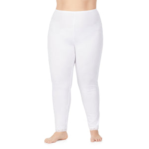 A lady wearing a white lace edge legging plus.