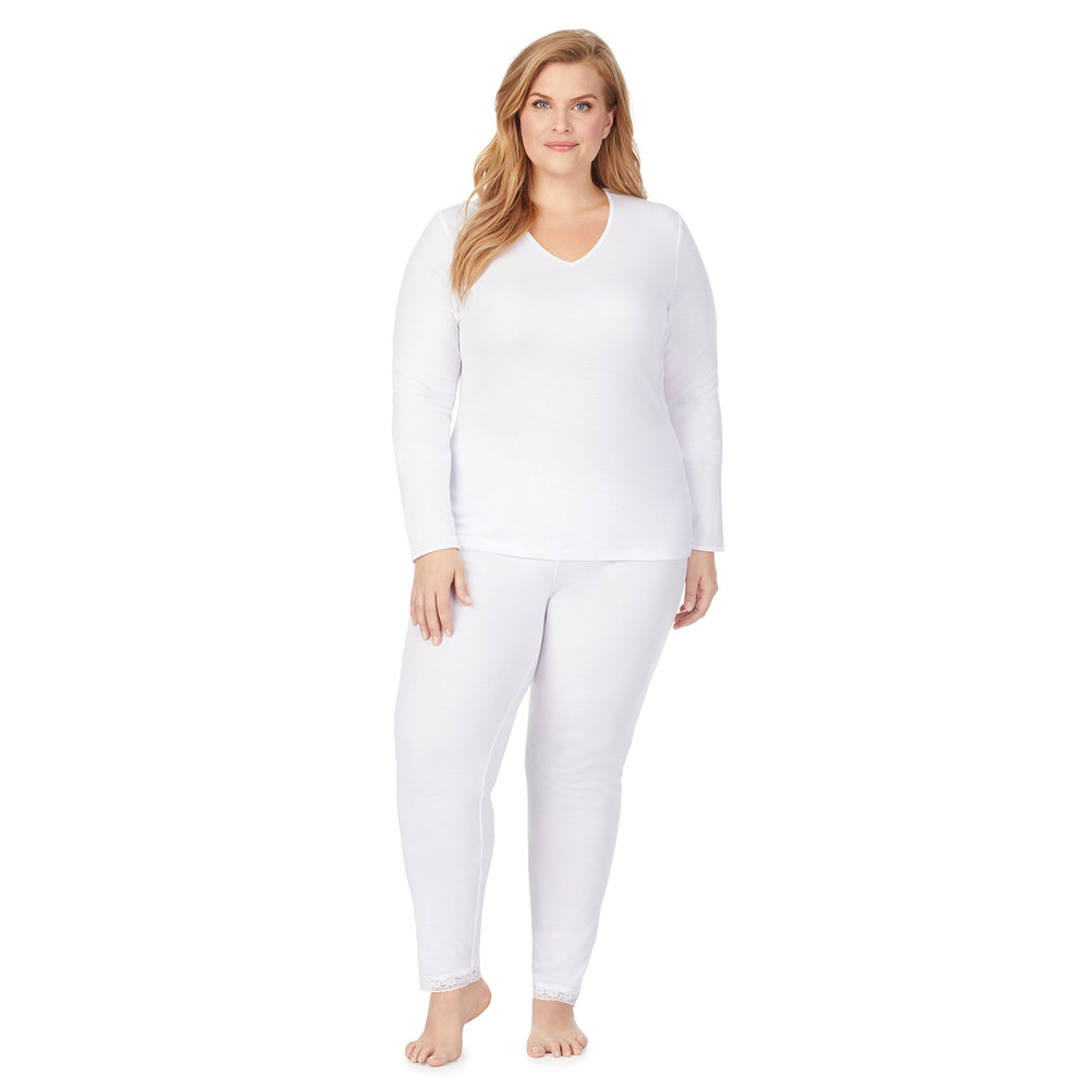 A lady wearing a white lace edge legging plus.