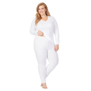 A lady wearing a white lace edge legging plus.