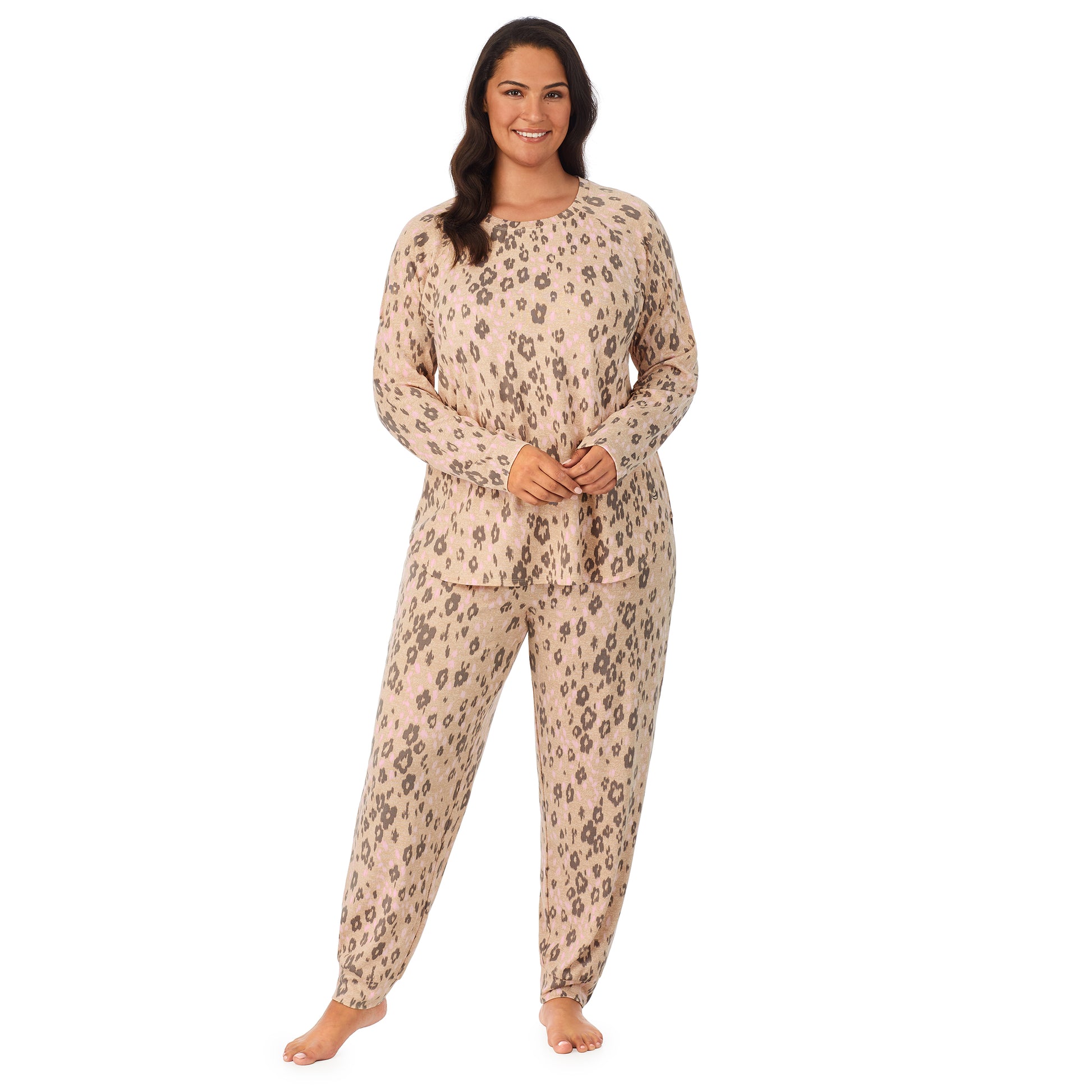 A lady wearing a beige long sleeve pajama set with leopard pattern.