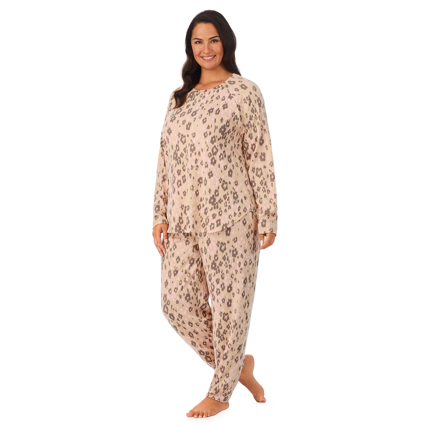 Leopard Animal; Model is wearing size 1X. She is 5’11”, Bust 38”, Waist 34”, Hips 46”. @A lady wearing a beige long sleeve pajama set with leopard pattern.