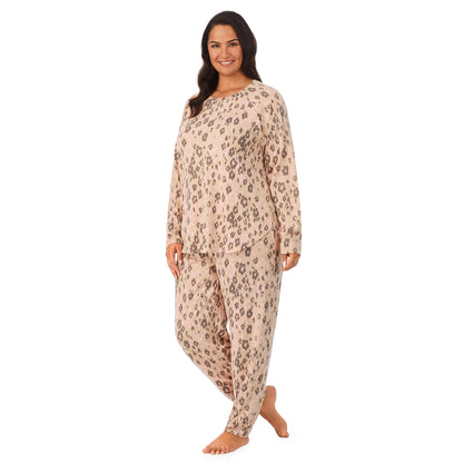 Leopard Animal; Model is wearing size 1X. She is 5’11”, Bust 38”, Waist 34”, Hips 46”. @A lady wearing a beige long sleeve pajama set with leopard pattern.