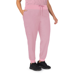 A lady wearing pink cameo heather scrub jogger pant plus.