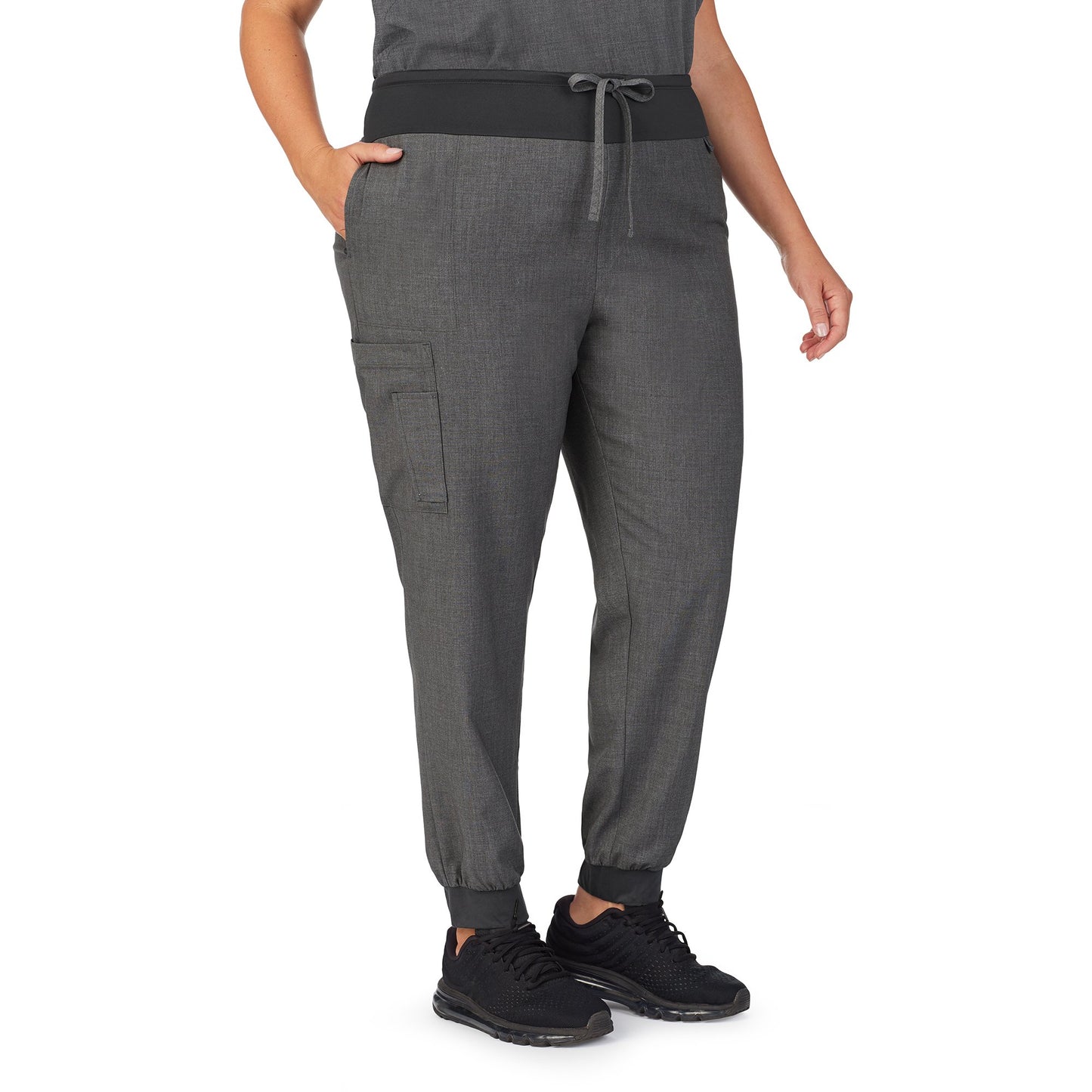 Charcoal Heather;Model is wearing size 1X. She is 5’9.5”, Bust 43”, Waist 37”, Hips 49.5”.@A lady wearing charcoal heather scrub jogger pant plus.