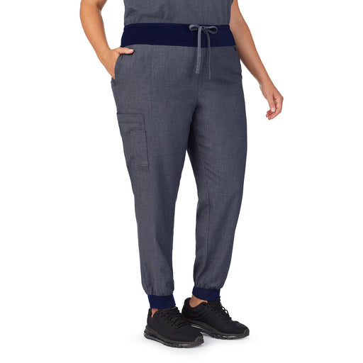 Navy Heather;Model is wearing size 1X. She is 5’9.5”, Bust 43”, Waist 37”, Hips 49.5”.@A lady wearing navy heather scrub jogger pant plus.