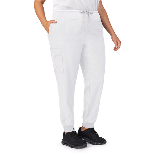 White;Model is wearing size 1X. She is 5’9.5”, Bust 43”, Waist 37”, Hips 49.5”.@A lady wearing white scrub jogger pant plus.