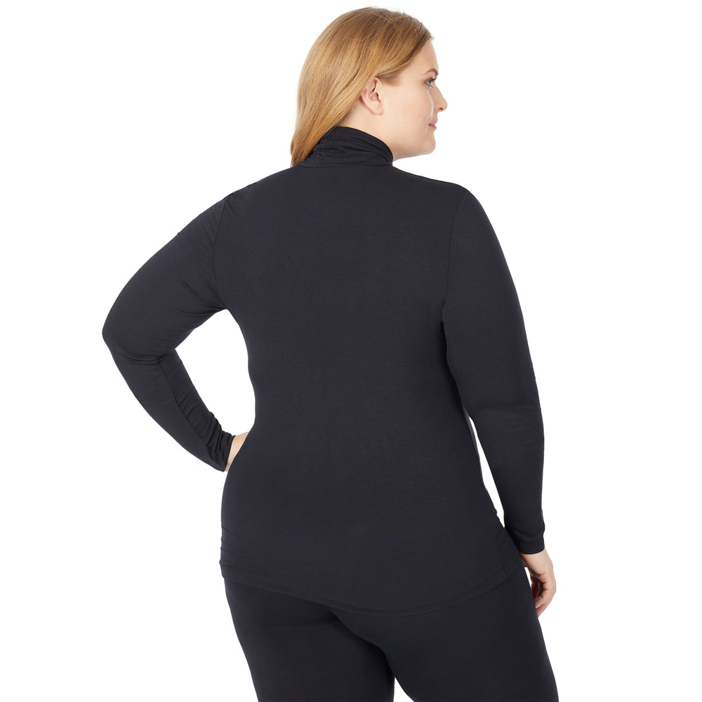 A lady wearing a black long sleeve stretch turtleneck t-shirt plus.