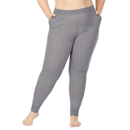 A lady wearing a grey heather legging plus.