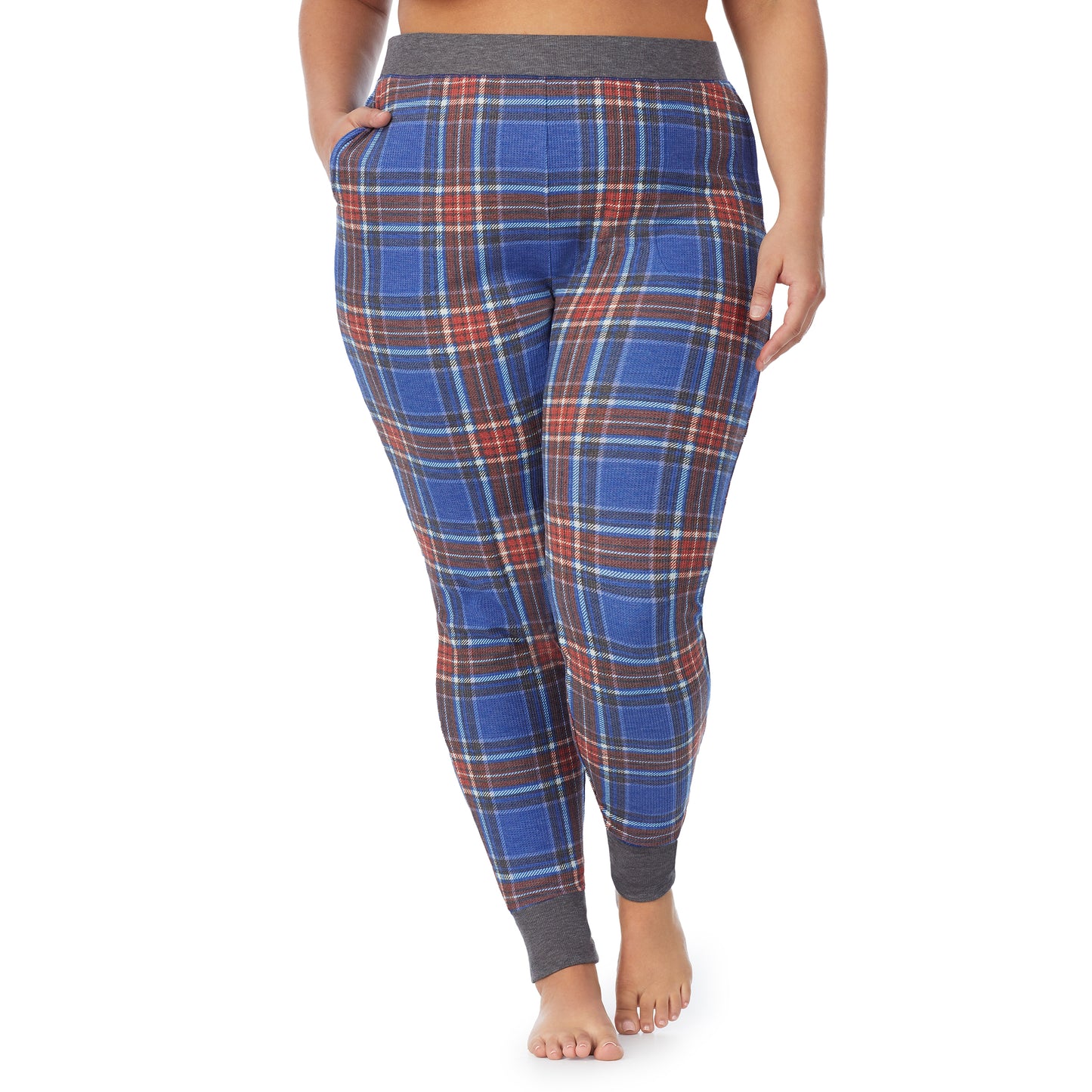 Red Blue Plaid; Model is wearing size 1X. She is 5'9", Bust 38", Waist 36", Hips 48.5".@A lady wearing a red blue plaid legging plus.