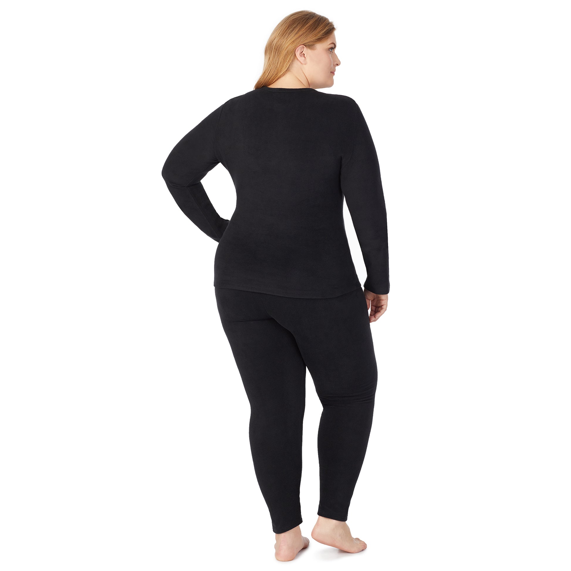 Black; Model is wearing size 1X. She is 5'9", Bust 38", Waist 36", Hips 48.5".@lower body of a lady wearing black legging