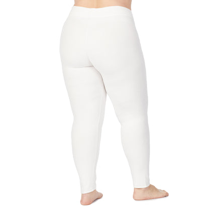 Off White; Model is wearing size 1X. She is 5'9", Bust 38", Waist 36", Hips 48.5".@lower body of a lady wearing white legging