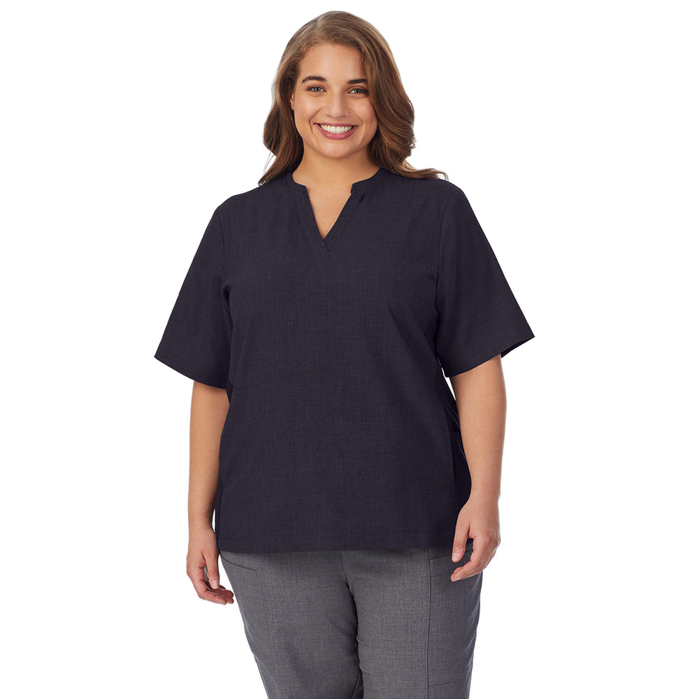 A lady wearing black scrub split neck top plus.
