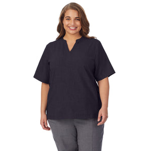  A lady wearing black scrub split neck top plus.