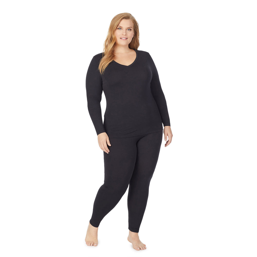 a lady wearing black long sleeve v-neck top