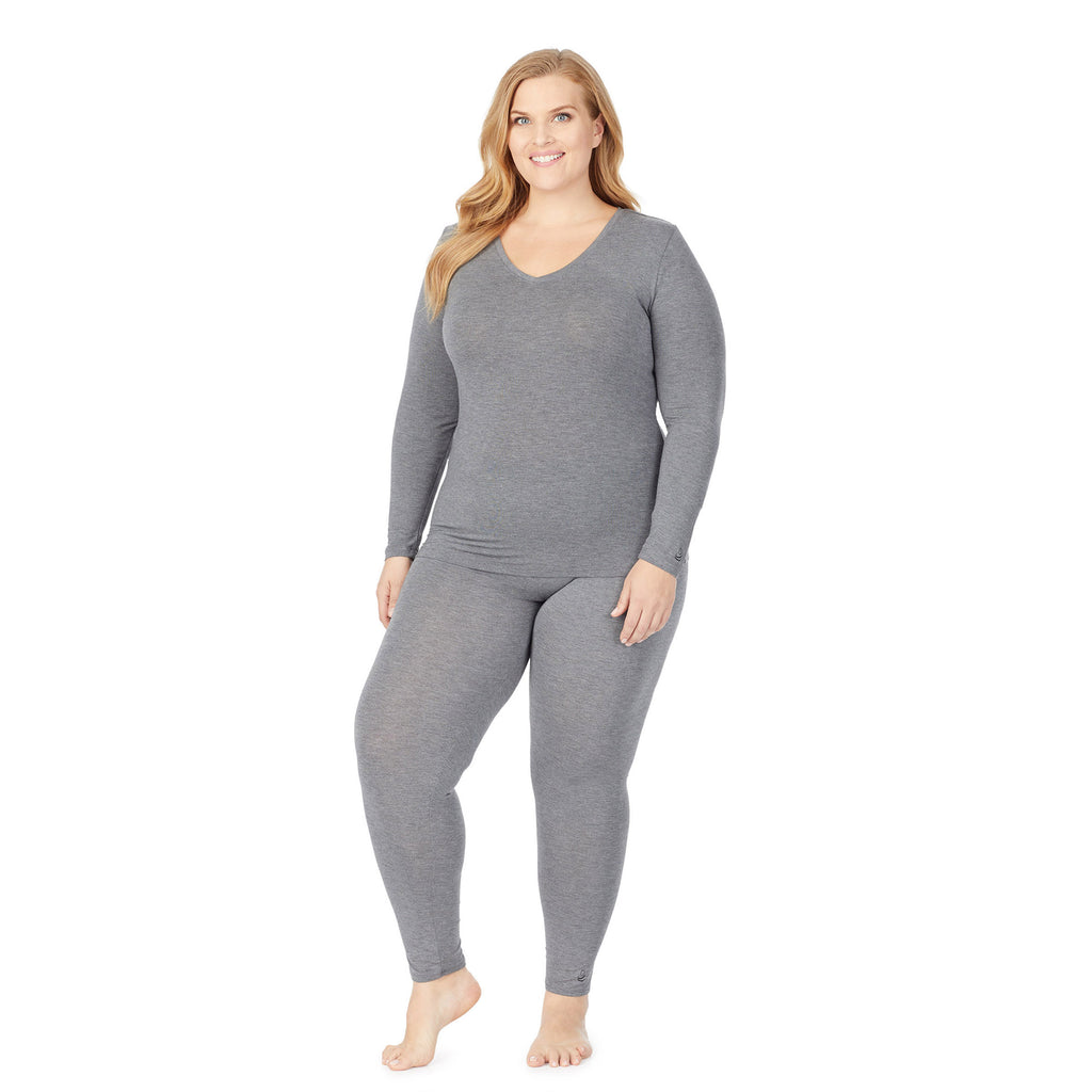 a lady wearing grey long sleeve v-neck top