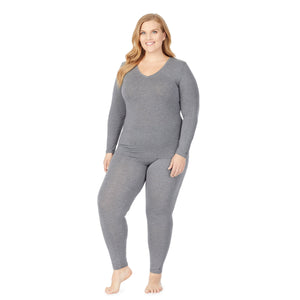 a lady wearing grey long sleeve v-neck top