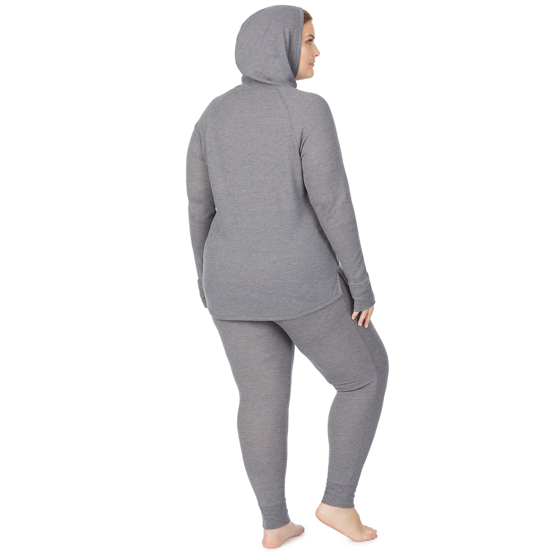 Stone Grey Heather; Model is wearing size 1X. She is 5'9", Bust 38", Waist 36", Hips 48.5". @A lady wearing a stone grey heather long sleeve hoodie tunic plus.
