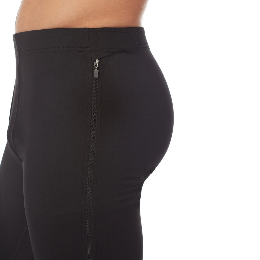 lower body of a man wearing black zip off pant