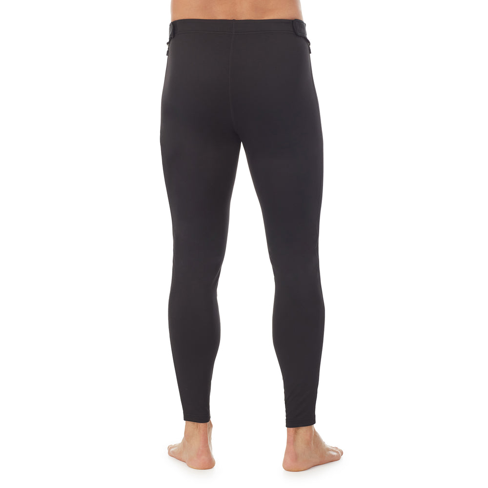 lower body of a man wearing black zip off pant